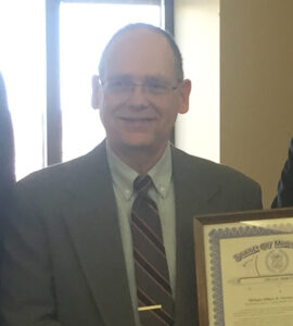 Roger Yoder holding certificate